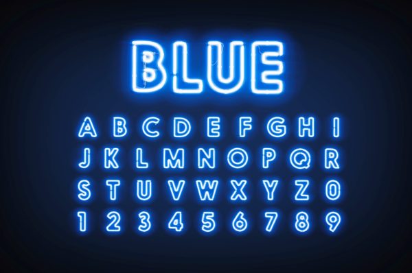 An example of argon used in decorative lighting glowing bright and spelling the word blue and then listing the alphabet and numerals 0 through 9
